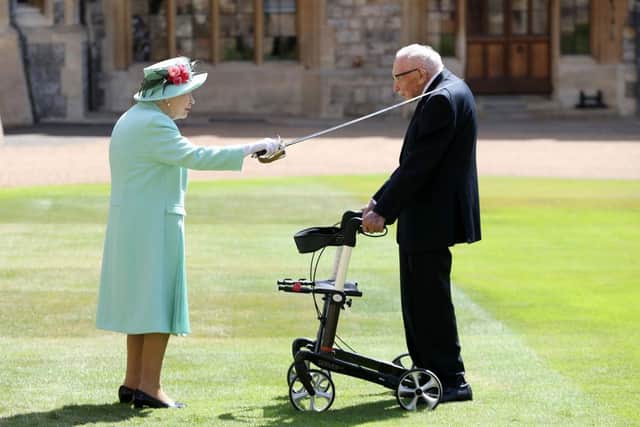 Queen Elizabeth II awards Captain Sir Thomas Moore with the insignia of Knight Bachelor at Windsor Castle on July 17, 2020 in Windsor, England. British World War II veteran Captain Tom Moore raised over £32 million for the NHS during the coronavirus pandemic. (Photo by Chris Jackson/Getty Images)