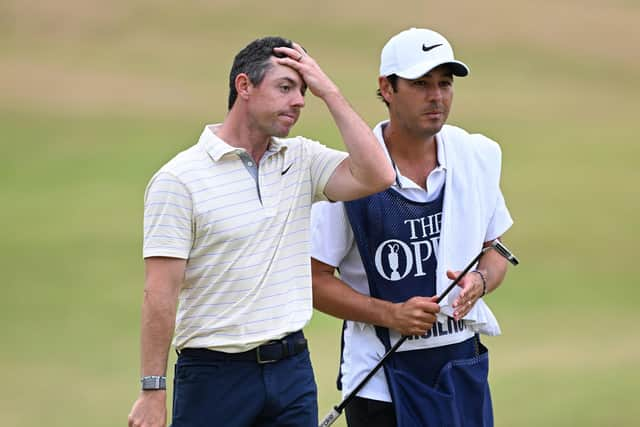 Rory McIlroy and his caddie Harry Diamond walk off the 18th green during the final round at the Old Course, St Andrews, Scotland. Pic: Ian Rutherford