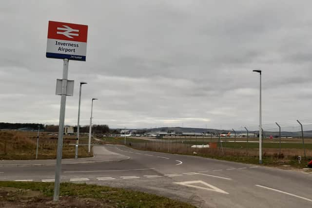 Inverness Airport is reassuringly visible to walkers from its new railway station. Picture: The Scotsman