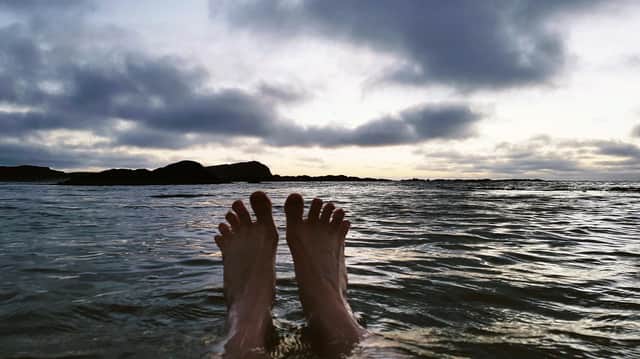 Jen MacNeill and one of her images from her sea swimming sessions which have helped her meet the challenges of being diagnosed with bi-polar. PIC: Jen MacNeill.