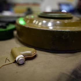 A dummy butterfly mine is seen as a group of people, many refugees, attend a lesson on recognising munitions and explosives. Anti-infantry high-explosive mines are now being used in Ukraine.  (Photo by Leon Neal/Getty Images)