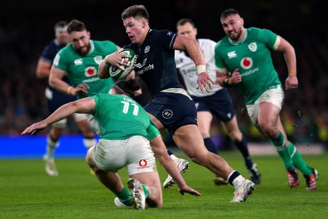 Scotland's Huw Jones runs through to score their try.