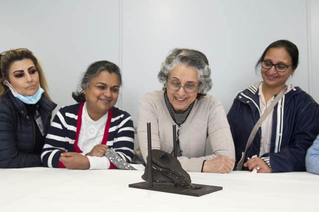 Members of Networking Key Services (NKS) - a health and welfare organisation supporting South Asian women and their families – viewing an object from the Margaret Tytler collection at National Museums Scotland. Picture by Neil Hanna