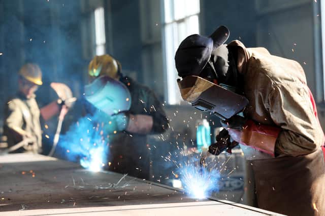 Four in ten businesses in Scotland say they are optimistic about prospects during 2021. Picture: AFP via Getty Images.