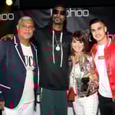 Mahmud Kamani (left) with Snoop Dogg, co-founder Carol Kane and son Samir Kamani (Getty Images)