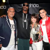 Mahmud Kamani (left) with Snoop Dogg, co-founder Carol Kane and son Samir Kamani (Getty Images)