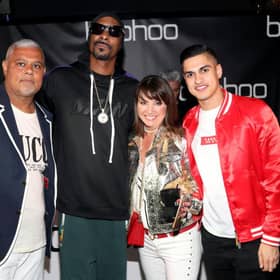 Mahmud Kamani (left) with Snoop Dogg, co-founder Carol Kane and son Samir Kamani (Getty Images)