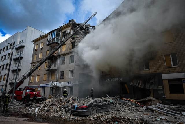Firefighters extinguish a fire after an apartment was hit by a missile strike in Kharkiv, where the zoo is based. Picture: Sergey Bobok/AFP via Getty Images