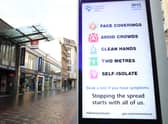 File photo of a coronavirus advice sign outside Argyle Street station in Glasgow.