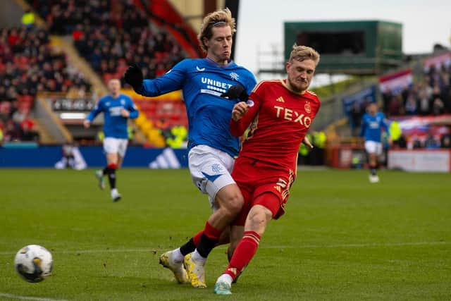 Aberdeen's Richard Jensen tackles Rangers' Todd Cantwell during the 1-1 draw at Pittodrie. (Photo by Craig Williamson / SNS Group)