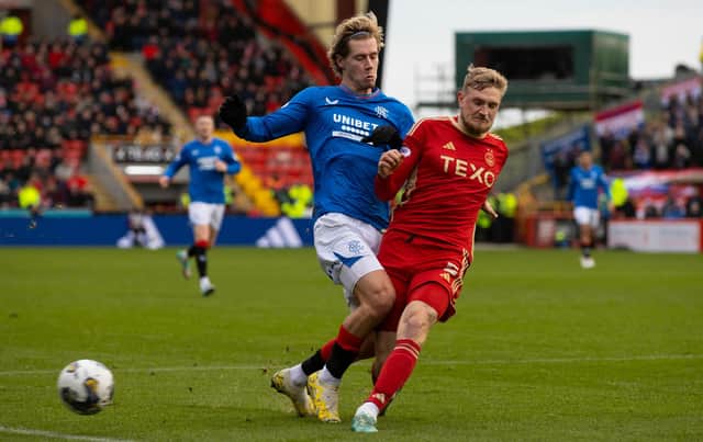Aberdeen's Richard Jensen tackles Rangers' Todd Cantwell during the 1-1 draw at Pittodrie. (Photo by Craig Williamson / SNS Group)