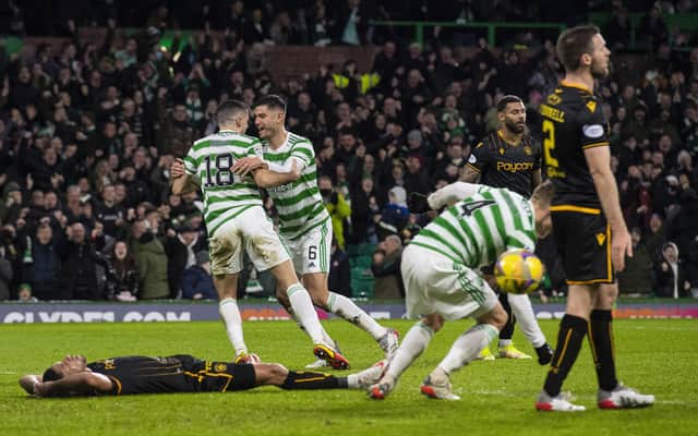 Celtic's Tom Rogic (left) celebrates with Nir Bitton after making it 1-0 against Motherwell.