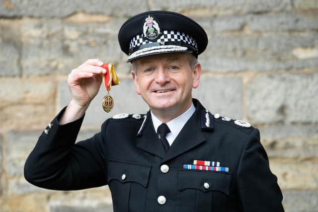 Chief Constable of Police Scotland, Iain Livingstone, poses with his medal after being appointed as a Knight Bachelor during an investiture ceremony at the Palace Of Holyroodhouse in Edinburgh earlier this year