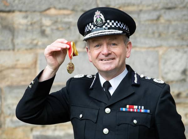 Chief Constable of Police Scotland, Iain Livingstone, poses with his medal after being appointed as a Knight Bachelor during an investiture ceremony at the Palace Of Holyroodhouse in Edinburgh earlier this year