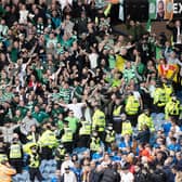 Celtic fans celebrate during a cinch Premiership match between Rangers and Celtic at Ibrox Stadium, on April 02, 2022, in Glasgow, Scotland.  (Photo by Craig Williamson / SNS Group)