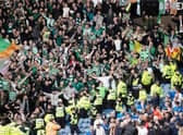 Celtic fans celebrate during a cinch Premiership match between Rangers and Celtic at Ibrox Stadium, on April 02, 2022, in Glasgow, Scotland.  (Photo by Craig Williamson / SNS Group)