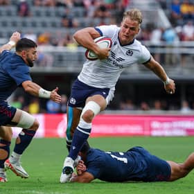 Duhan van der Merwe avoids the tackle attempts of USA's Nate Augspurger (11) and Tavite Lopeti (13) at Audi Field in Washington DC to score the try which equalled Stuart Hogg's all-time Scotland try record. (Photo by Scott Taetsch/Getty Images for Scottish Rugby)
