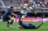 Duhan van der Merwe avoids the tackle attempts of USA's Nate Augspurger (11) and Tavite Lopeti (13) at Audi Field in Washington DC to score the try which equalled Stuart Hogg's all-time Scotland try record. (Photo by Scott Taetsch/Getty Images for Scottish Rugby)