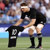 Sam Cane of the All Blacks lays down a No 10 jersey in memory of Diego Maradona prior to the Tri-Nations match against Argentina. Picture: Brendon Thorne/Getty Images