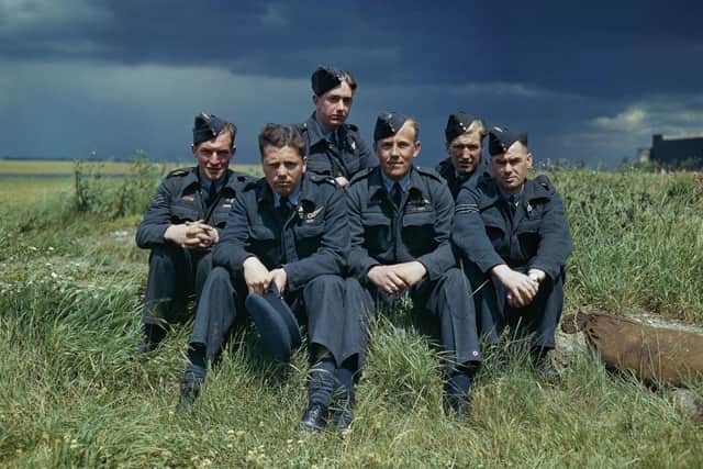 A still from the film Lancaster showing the crew of Lancaster ED285/`AJ-T' of 617 Squadron (Dambusters) at Scampton, Lincolnshre, 22 July 1943. From left to right: Sergeant G Johnson; Pilot Officer DA MacLean, navigator; Flight Lieutenant JC McCarthy, pilot; Sergeant L Eaton, gunner. In the rear are Sergeant R Batson, gunner; and Sergeant WG Ratcliffe, engineer.