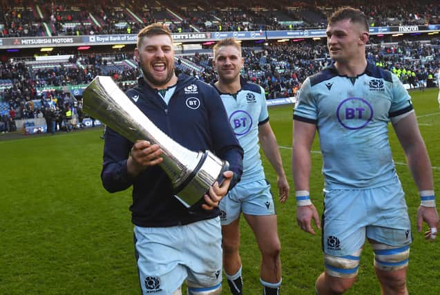 Nick Haining gets his hands on the Auld Alliance trophy after Scotland's win over France in March. Chris Harris and Magnus Bradbury join in the celebrations. Picture: Gary Hutchison/SNS