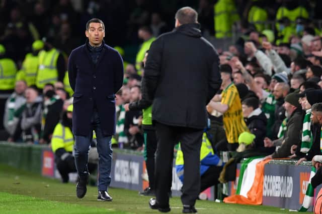 Rangers manager Giovanni van Bronckhorst interacts with Celtic manager Ange Postecoglou during Wednesday night's Old Firm clash. (Photo by Mark Runnacles/Getty Images)