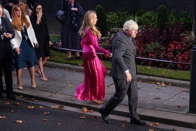 Carrie Johnson and outgoing Prime Minister Boris Johnson leave Downing Street. Mr Johnson held his wife’s hand and shook hands with officials as he left the street to rapturous applause.