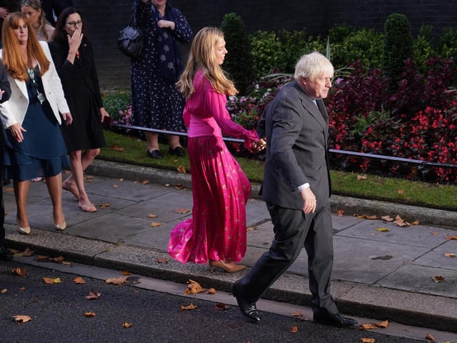 Carrie Johnson and outgoing Prime Minister Boris Johnson leave Downing Street. Mr Johnson held his wife’s hand and shook hands with officials as he left the street to rapturous applause.