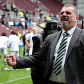 Ange Postecoglou celebrates winning the title after a 2-0 triumph over Hearts at Tynecastle.