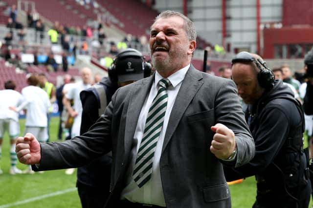 Ange Postecoglou celebrates winning the title after a 2-0 triumph over Hearts at Tynecastle.