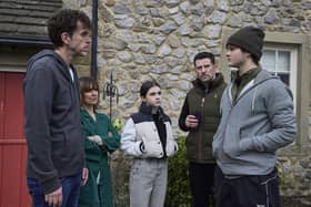 Fred Kettle on set at Emmerdale with his co-stars. Photo: ITV