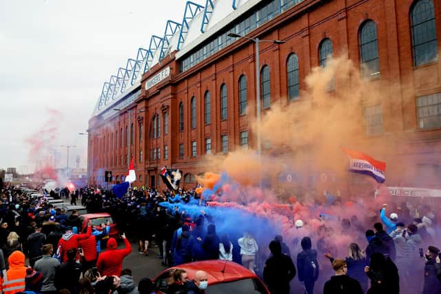 Rangers fans gathered outside of Ibrox a week past Saturday as their side moved closer to the title. Picture: SNS
