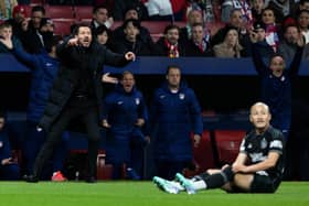 Atletico Madrid manager Diego Simeone reacts to a red card tackle from Celtic's Daizen Maeda.