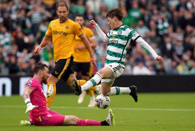 Wolverhampton Wanderers goalkeeper Jose Sa saves at the feet of Celtic’s Kyogo Furuhashi.
