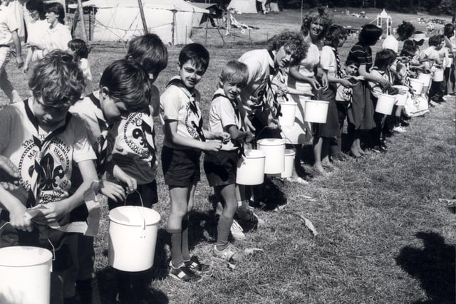 Passing the bucket in the giant line in a record attempt at the Scout camp at Hesley Wood, Chapeltown on June 21 1986