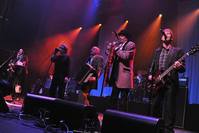 A more recent incarnation of the Pogues from 2011 - with James Fearnely (3rd from right) and Spider Stacy (2nd from right) and Shane MacGowan at the microphone (Photo by Theo Wargo/Getty Images)