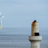 Scotland's wind turbines are producing increasing amounts of electricity and wealth (Picture: Andy Buchanan/AFP via Getty Images)