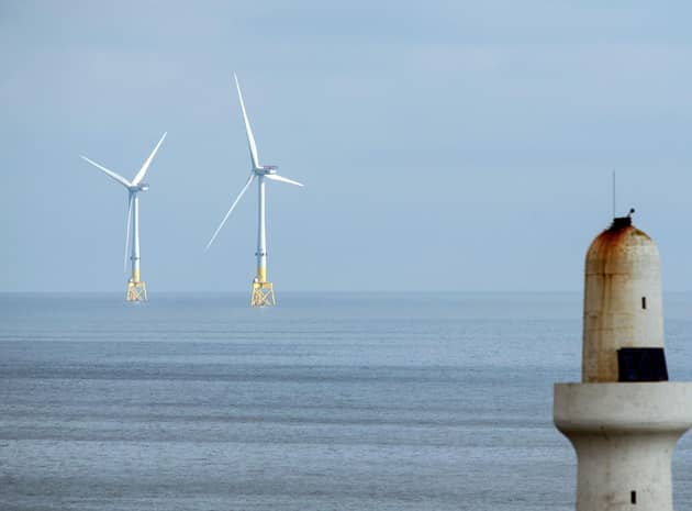 Scotland's wind turbines are producing increasing amounts of electricity and wealth (Picture: Andy Buchanan/AFP via Getty Images)