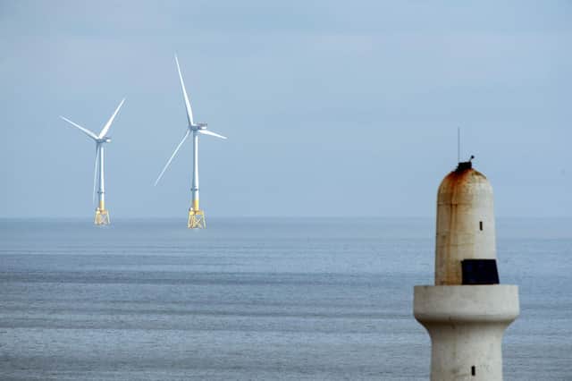 Scotland's wind turbines are producing increasing amounts of electricity and wealth (Picture: Andy Buchanan/AFP via Getty Images)