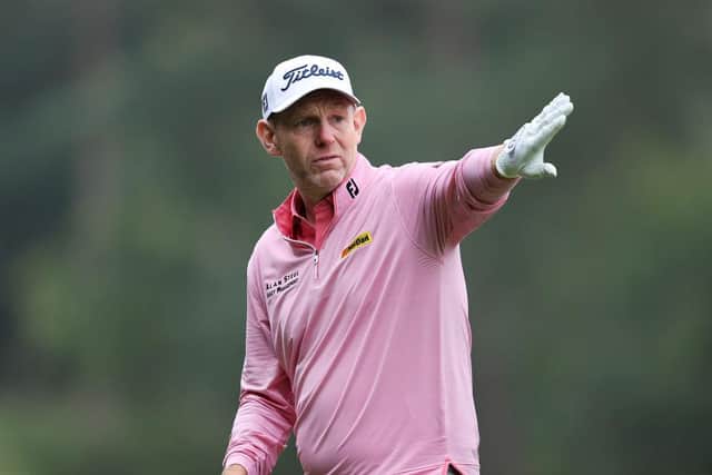 Stephen Gallacher points to his line at The BMW PGA Championship at Wentworth earlier this month. He pairs with sportswriter David Walsh. (Photo by Warren Little/Getty Images)