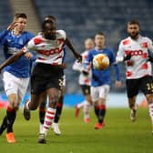Merveille Bokadi of Standard Liege is challenged by Cedric Itten of Rangers during the UEFA Europa League Group D stage match . (Photo by Ian MacNicol/Getty Images)