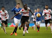 Merveille Bokadi of Standard Liege is challenged by Cedric Itten of Rangers during the UEFA Europa League Group D stage match . (Photo by Ian MacNicol/Getty Images)