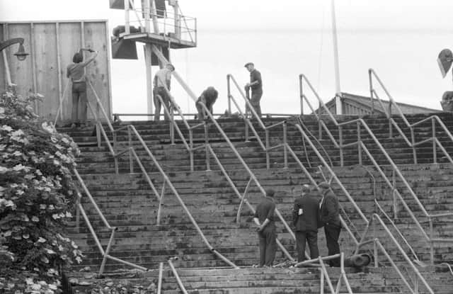 June 1971 - workmen clear the barricades from stairway 13 at Ibrox football stadium, scene of the Ibrox Disaster in February 1971