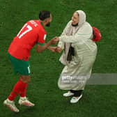 Sofiane Boufal of Morocco celebrates with his Mother after the team's 1-0 victory in the FIFA World Cup Qatar 2022 quarter final match between Morocco and Portugal at Al Thumama Stadium, December 2022 in Qatar. Pic: Patrick Smith - FIFA/FIFA via Getty Images.