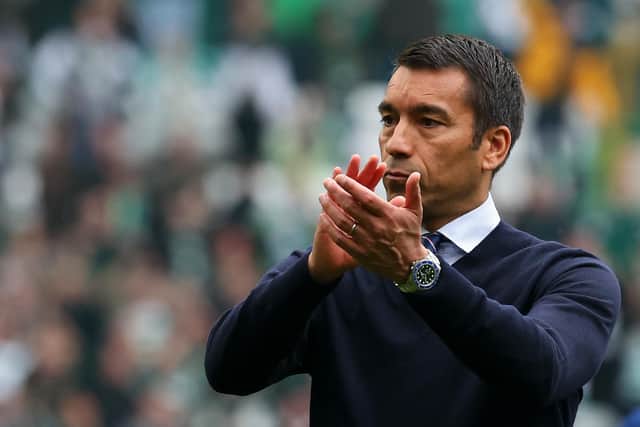 Rangers manager Giovanni van Bronckhorst applauds the away supporters at Celtic Park after his team's 1-1 draw on Sunday. (Photo by Ian MacNicol/Getty Images)