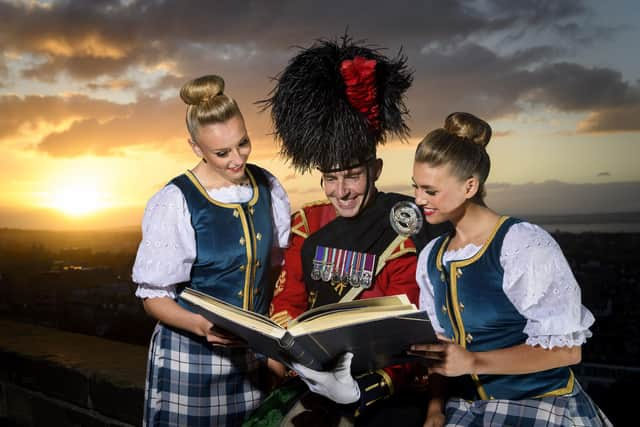 Tattoo dancers Laynie Seaton and Rosey Watt with Senior Drum Major Allan Campbell.