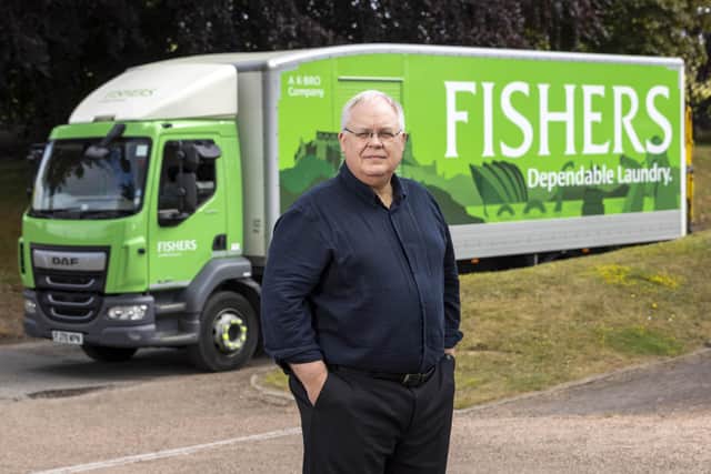 Fishers’ managing director, Michael Jones, with one of the firm's familiar trucks. Picture: Robert Perry