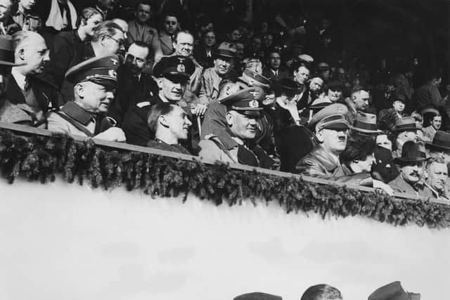 From right to left, German Chancellor Adolf Hitler, General Werner von Blomberg, Joseph Goebbels and General Werner von Fritsch watch the final ski jumping contest in the Winter Olympics at Garmisch-Partenkirchen, Germany, February 1936. (Photo by Keystone/Hulton Archive/Getty Images)