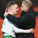 Celtic manager Ange Postecoglou and Callum McGregor embrace as the title is delivered at Tannadice on Wednesday. The two men were monumental in their roles as manager and captain to bringing about the success. (Photo by Ross Parker / SNS Group)