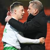 Celtic manager Ange Postecoglou and Callum McGregor embrace as the title is delivered at Tannadice on Wednesday. The two men were monumental in their roles as manager and captain to bringing about the success. (Photo by Ross Parker / SNS Group)